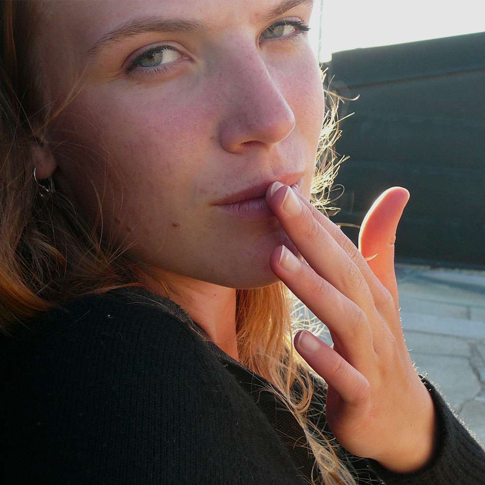 Woman touching her lip